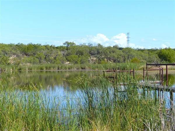 a view of lake with green space