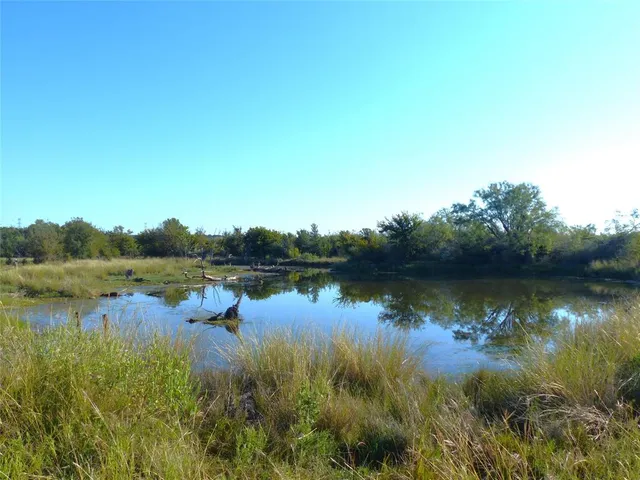 a view of lake with green space