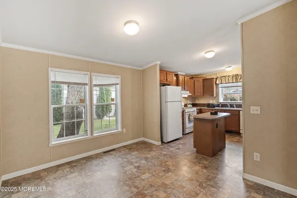 a view of a kitchen with appliances and a window