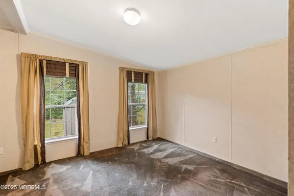 an empty room with windows