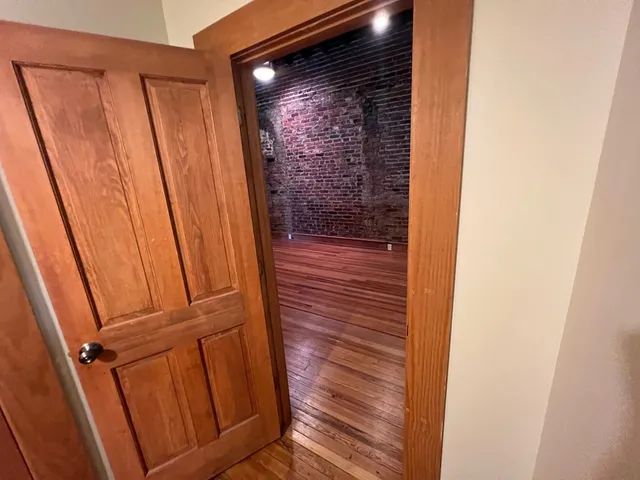 a view of wooden floor in an empty room