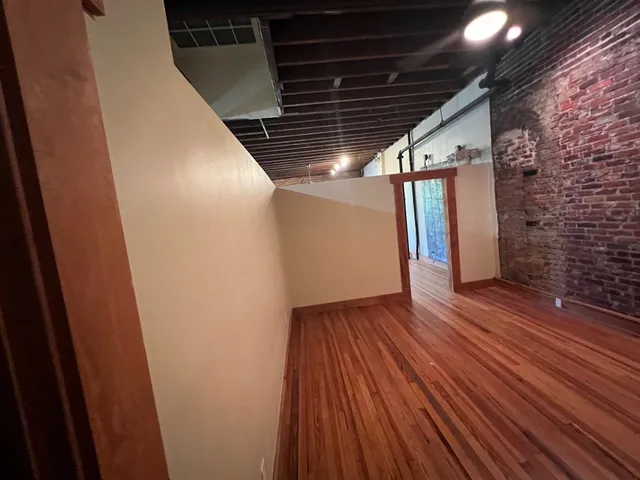 a storage and utility room with a shower