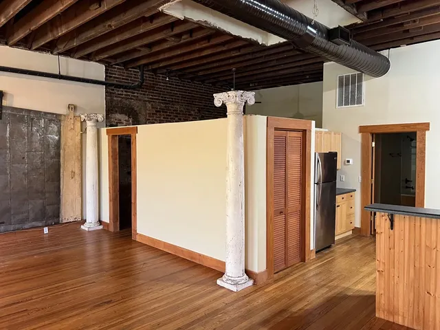 a white toilet sitting next to a bath tub