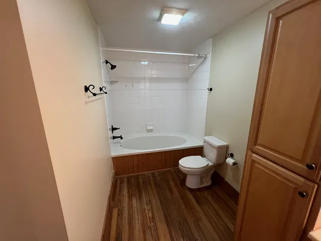 a bathroom with a sink a large mirror and vanity