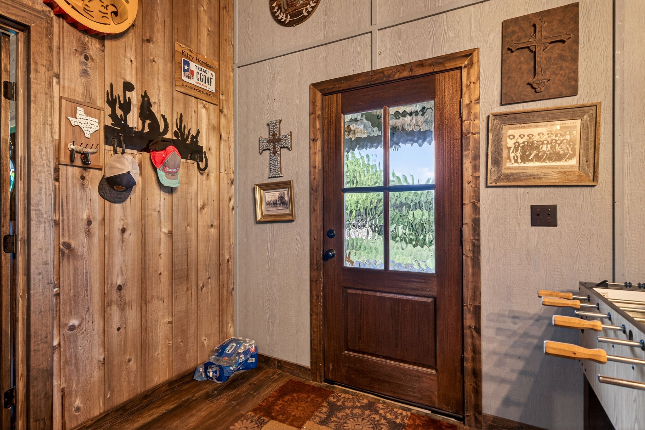 1850 Ranch Road 337 Leakey, TX 78873 - Photo 26 of 50 Spacious living area featuring updated flooring and a wood-burning fireplace for cozy Hill Country evenings