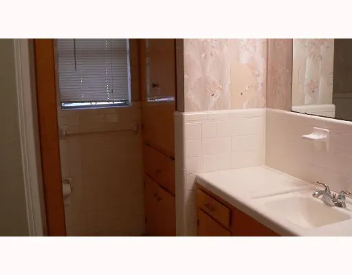 a bathroom with a sink and mirror