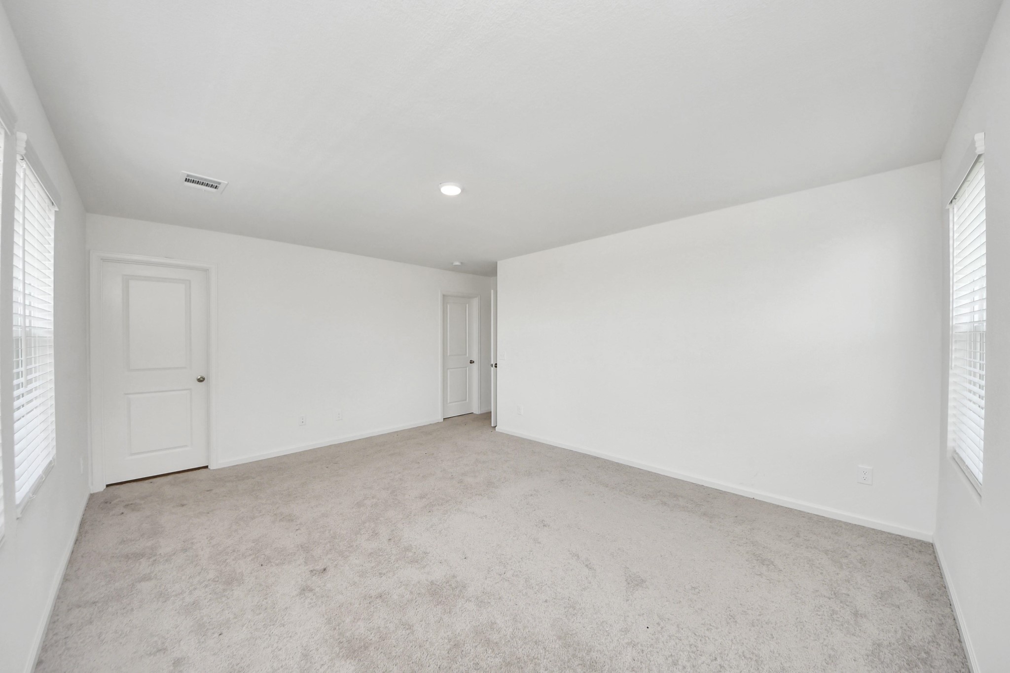 10303 Rose Mar Drive, Unit B Rosharon, TX 77583 - Photo 20 of 49 an empty room with a natural light