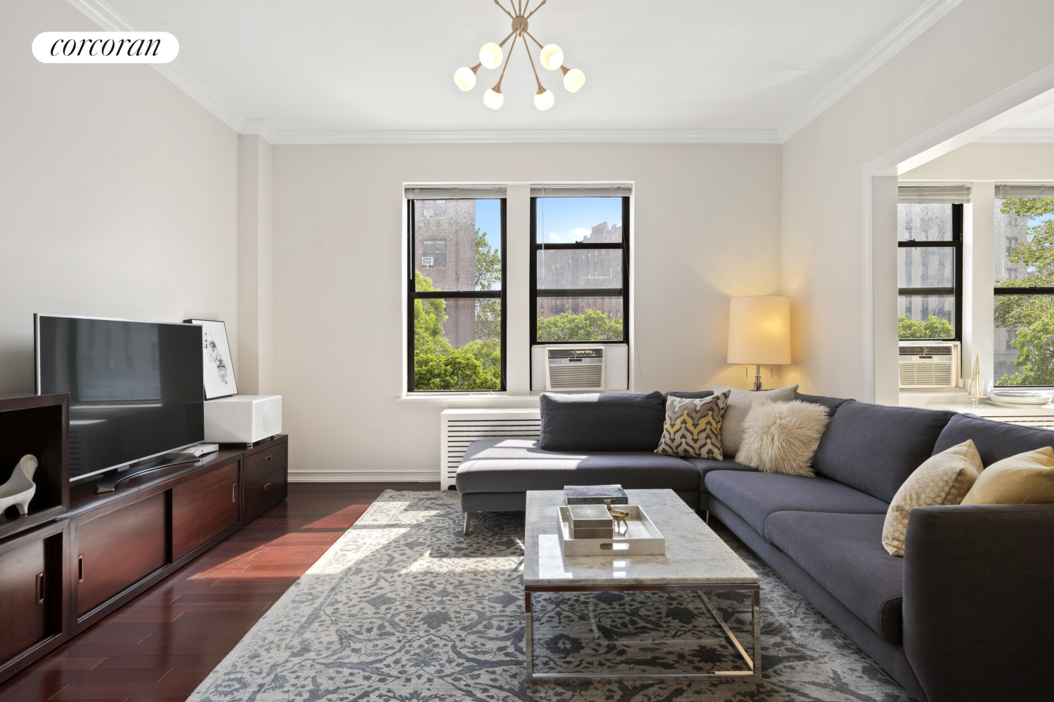 7401 4th Avenue, Unit B4 Brooklyn, NY 11209 - Photo 1 of 14 a living room with furniture and a flat screen tv