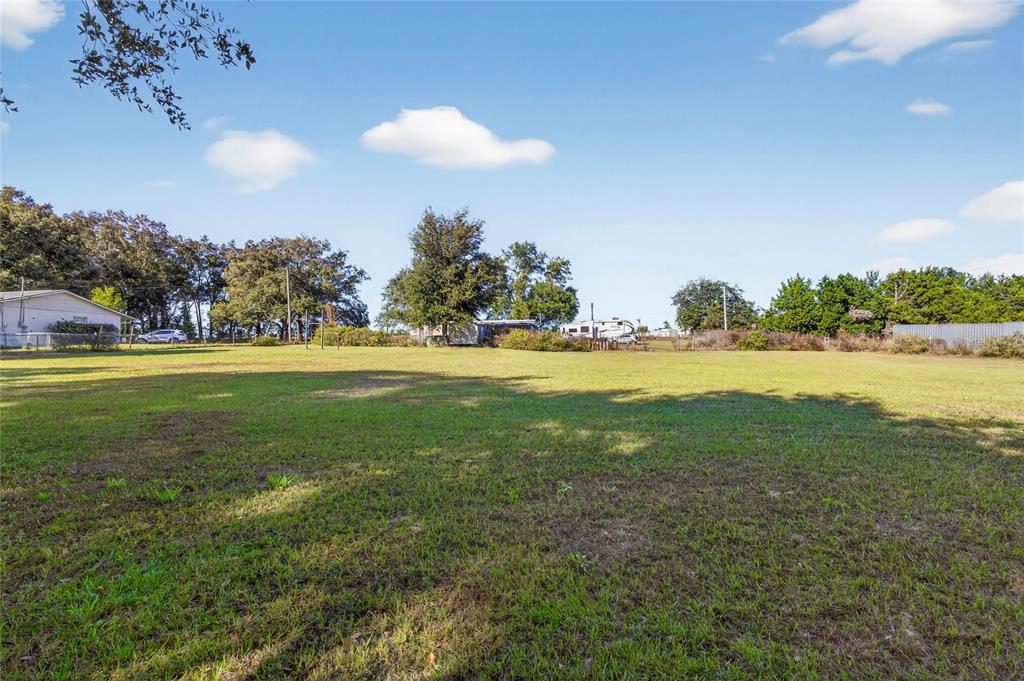 38710 Townsend Road Dade City, FL 33525 - Photo 16 of 17 a view of a golf course with a lake