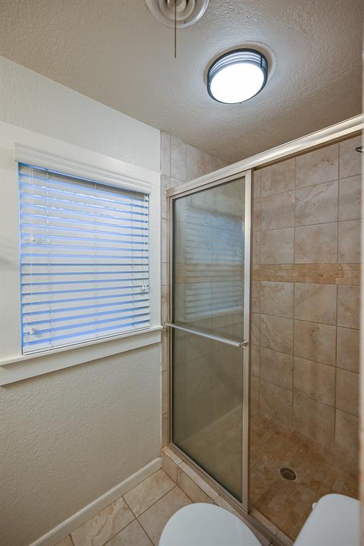 1300 South Trinity Street Decatur, TX 76234 - Photo 8 of 18 a bathroom with a shower