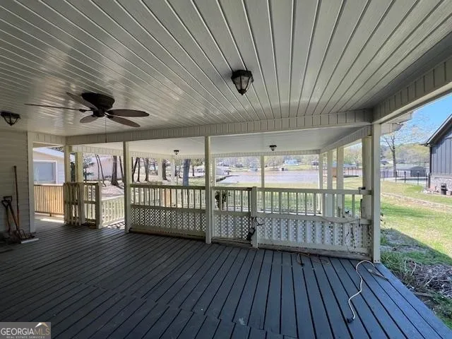 a view of a porch with wooden floor