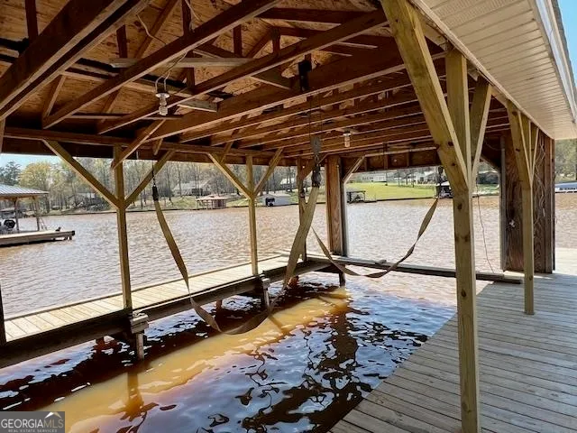 a view of swimming pool with wooden stairs