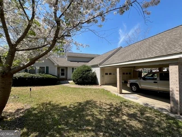 a view of a car in front of house