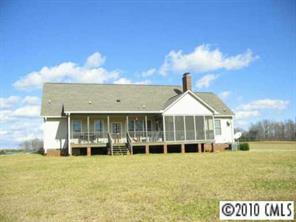 410 Bridle Path Farm Road Cleveland, NC 27013 - Photo 2 of 8 a front view of a house with a garden