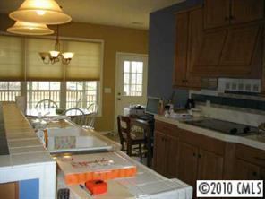 410 Bridle Path Farm Road Cleveland, NC 27013 - Photo 4 of 8 a kitchen with a stove a sink and a cabinets