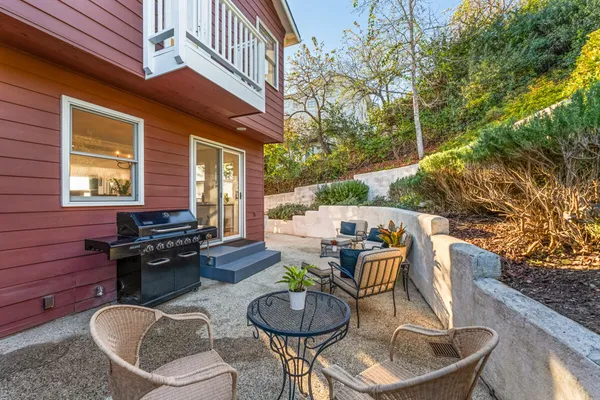 a view of a patio with table and chairs and potted plants