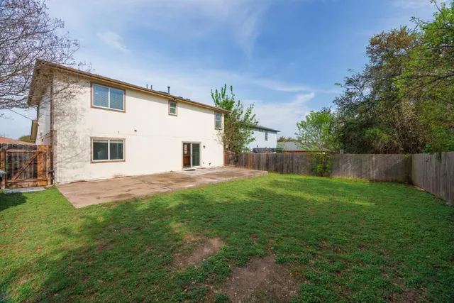 a backyard of a house with lots of green space