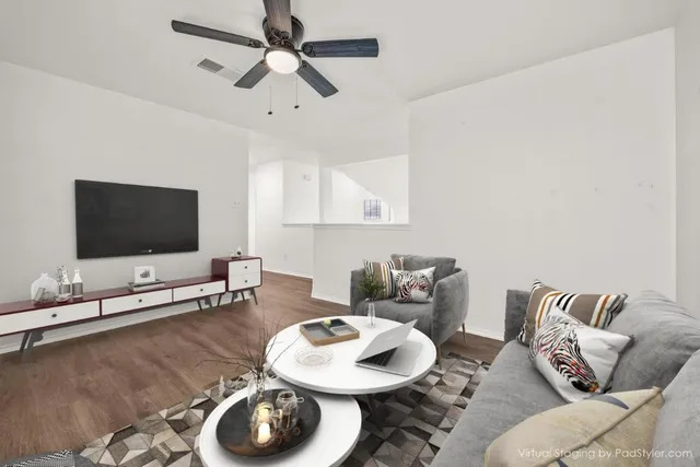 an empty room with wooden floor