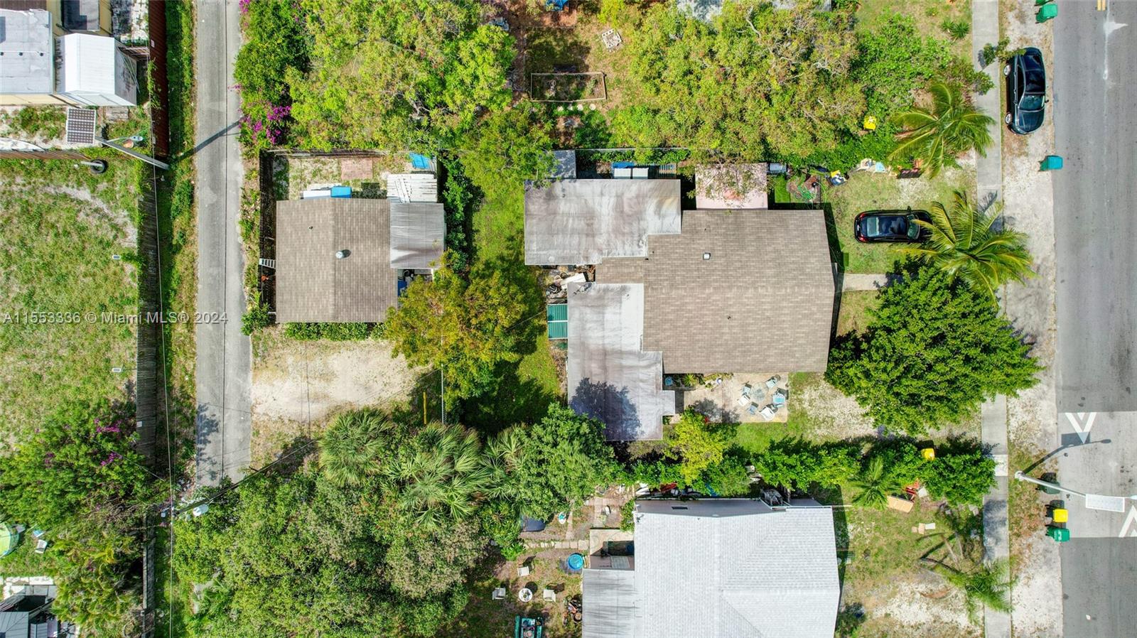 an aerial view of a house with a yard and garden