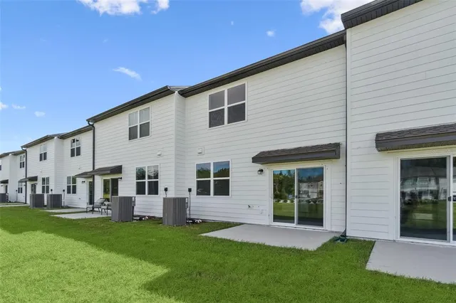 a view of an house with backyard space and garden