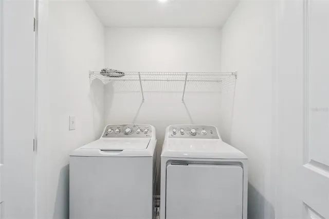 a utility room with dryer and washer