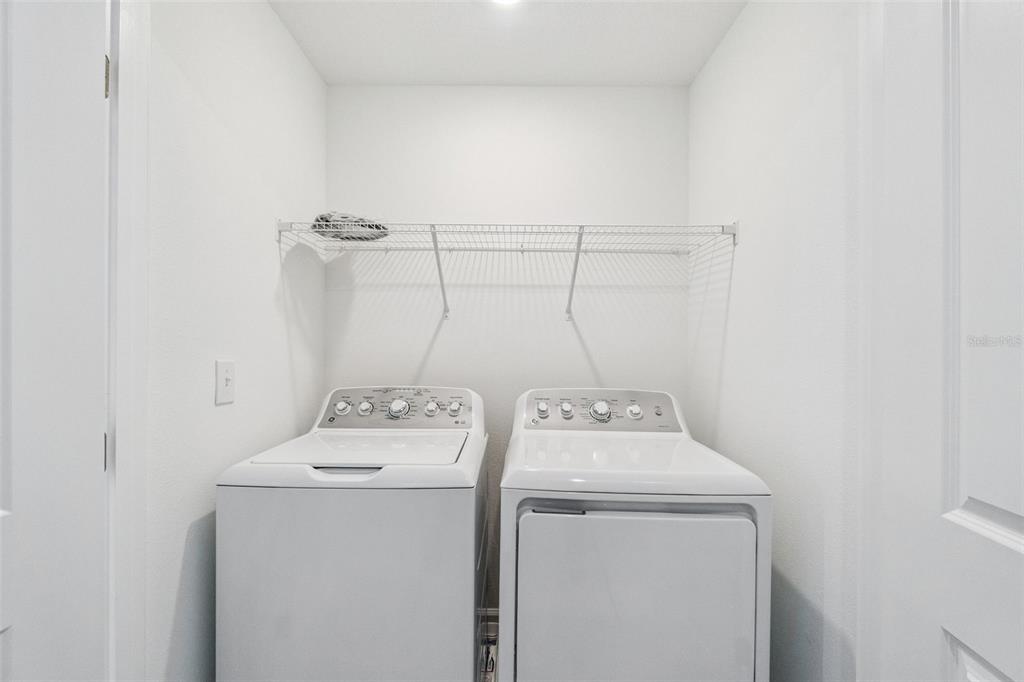 3613 Spire Drive Davenport, FL 33837 - Photo 20 of 20 a utility room with dryer and washer