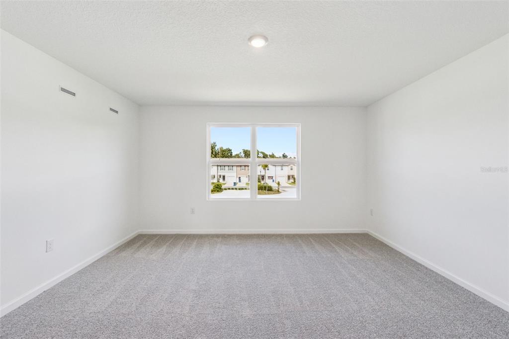 3613 Spire Drive Davenport, FL 33837 - Photo 5 of 20 an empty room with a window