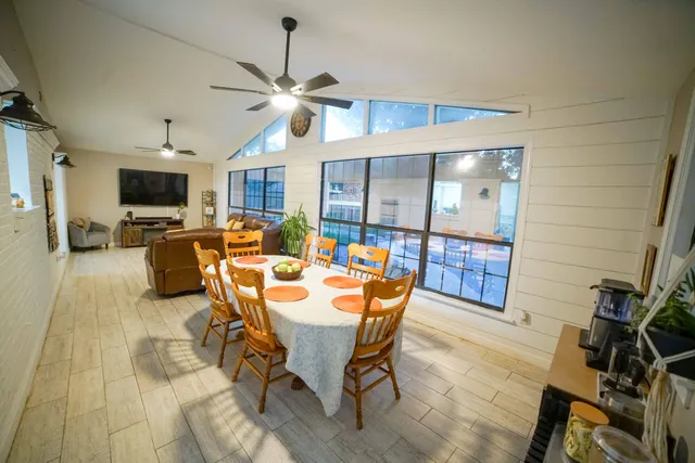 a view of a dining room with furniture and a livingroom