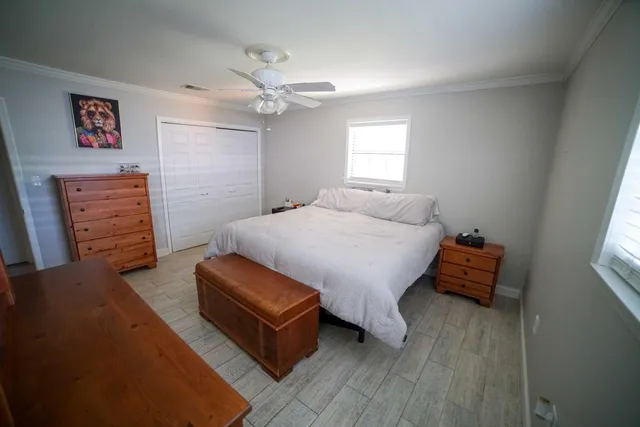 a bedroom with furniture and wooden floor