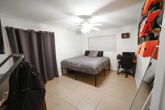 a bedroom with a bed and a walk in closet