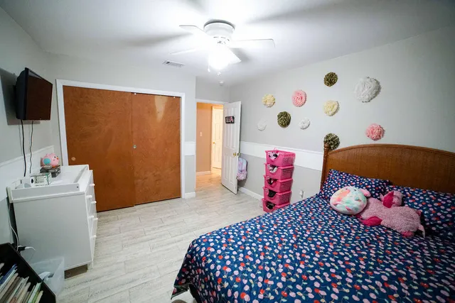 a bedroom with a bed and a tv in it