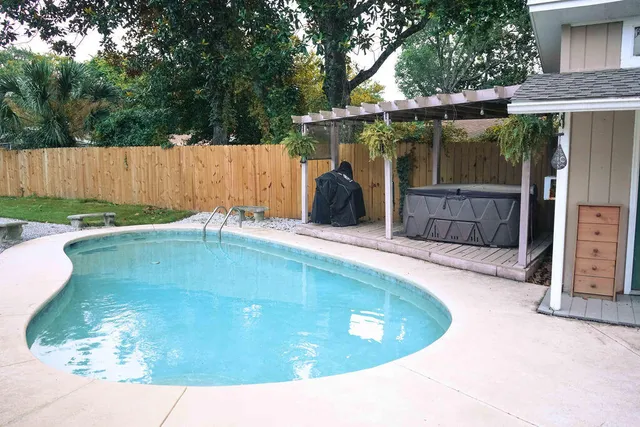 a view of a backyard with a small cabin