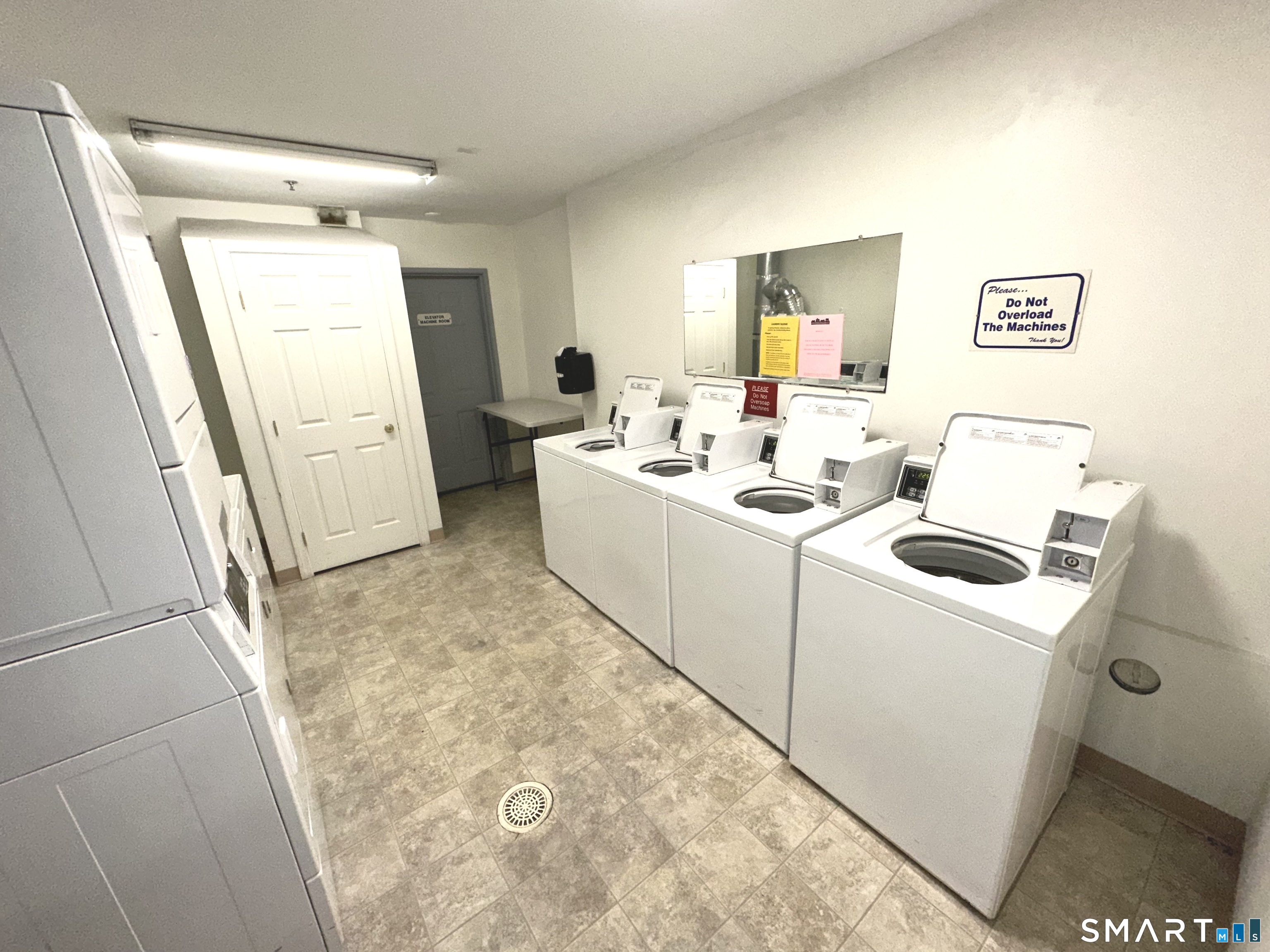 243 Judd Square, Unit 243 Wallingford, CT 06492 - Photo 16 of 17 a utility room with dryer and washer