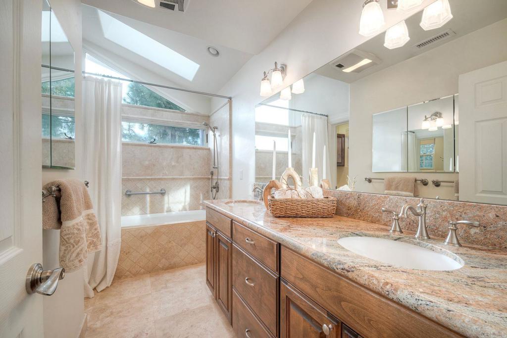 13253 Edina Way Poway, CA 92064 - Photo 12 of 55 Double sinks, shower/bath combo with skylight and high window, separate water closet