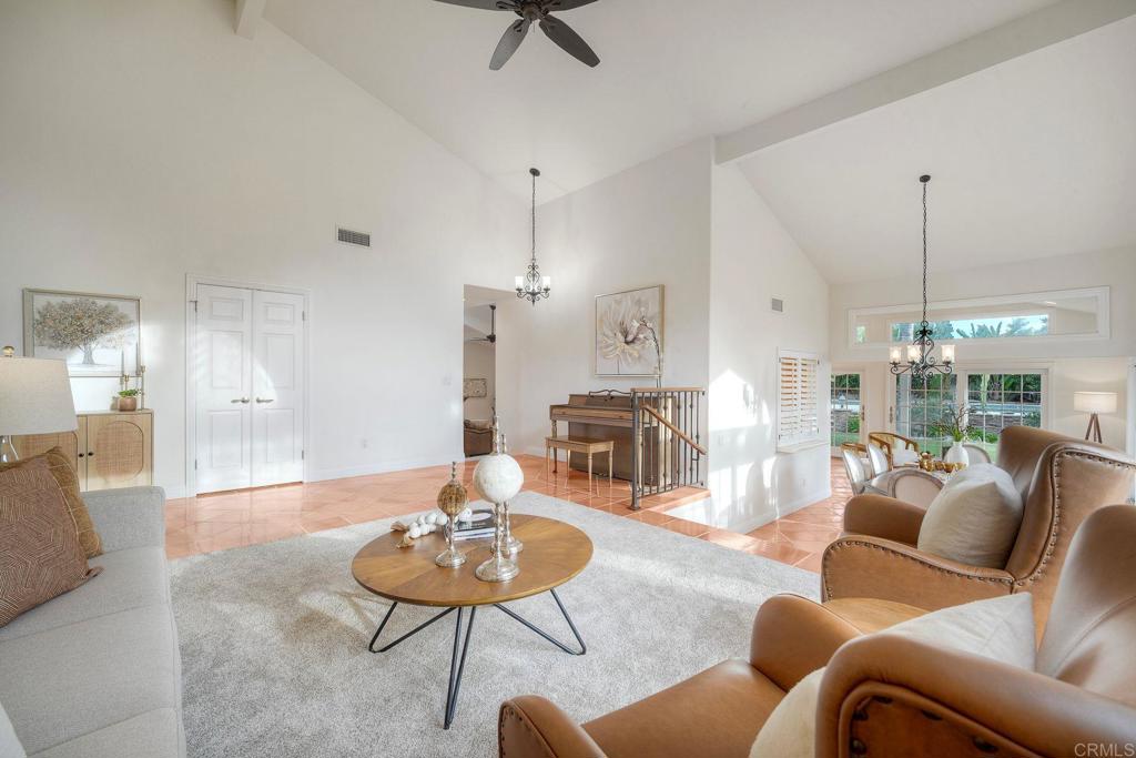 13253 Edina Way Poway, CA 92064 - Photo 16 of 55 Behing the closed double doors is a bathroom, to the left of the piano are 4 stairs to family room