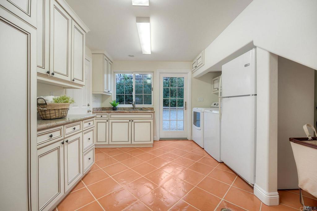 13253 Edina Way Poway, CA 92064 - Photo 30 of 55 Large laundry room, washer/dryer and refrigerator included, generous cabinet space, door to garage