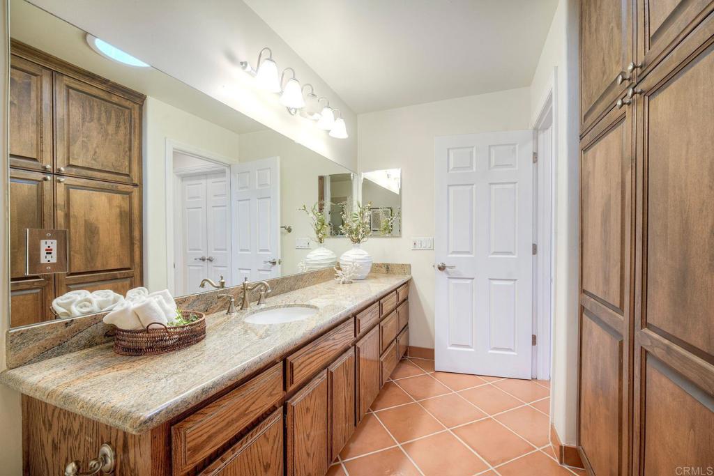 13253 Edina Way Poway, CA 92064 - Photo 8 of 55 accessed from the hall and from the bedroom. Full bathroom with a walk in shower.