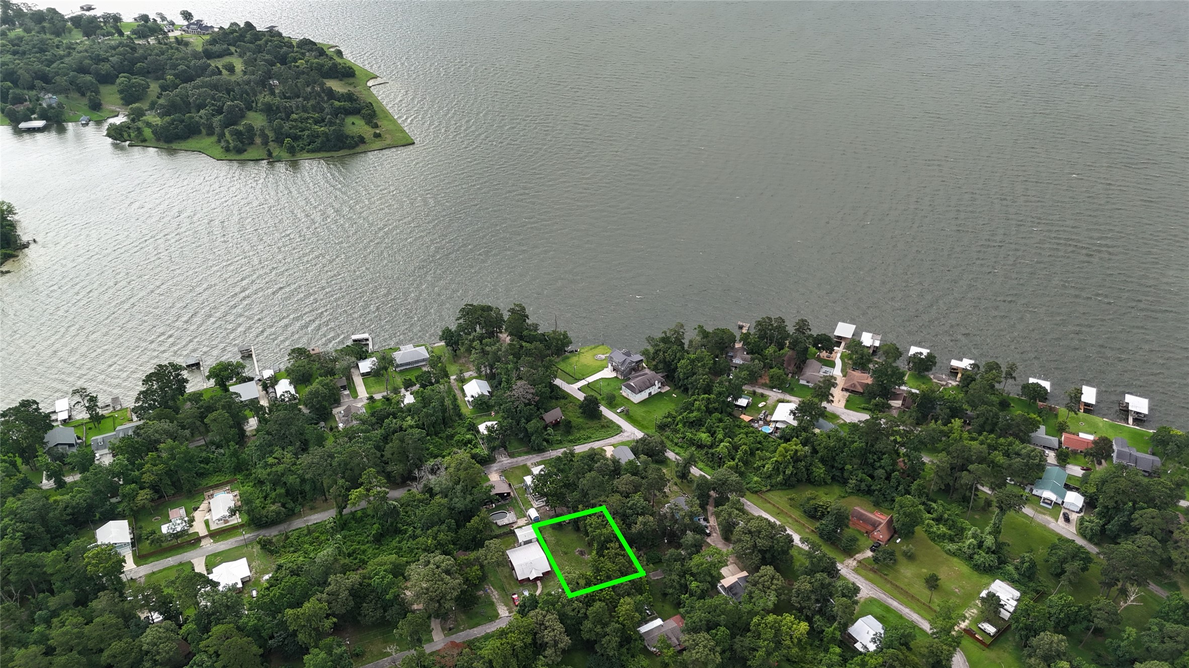 Aerial view of your lots in relation to the lake and nearby houses.  Perfect setting for lake living at an affordable price.  000 Walnut Lane in North Wood subdivision locate in Point Blank, TX
