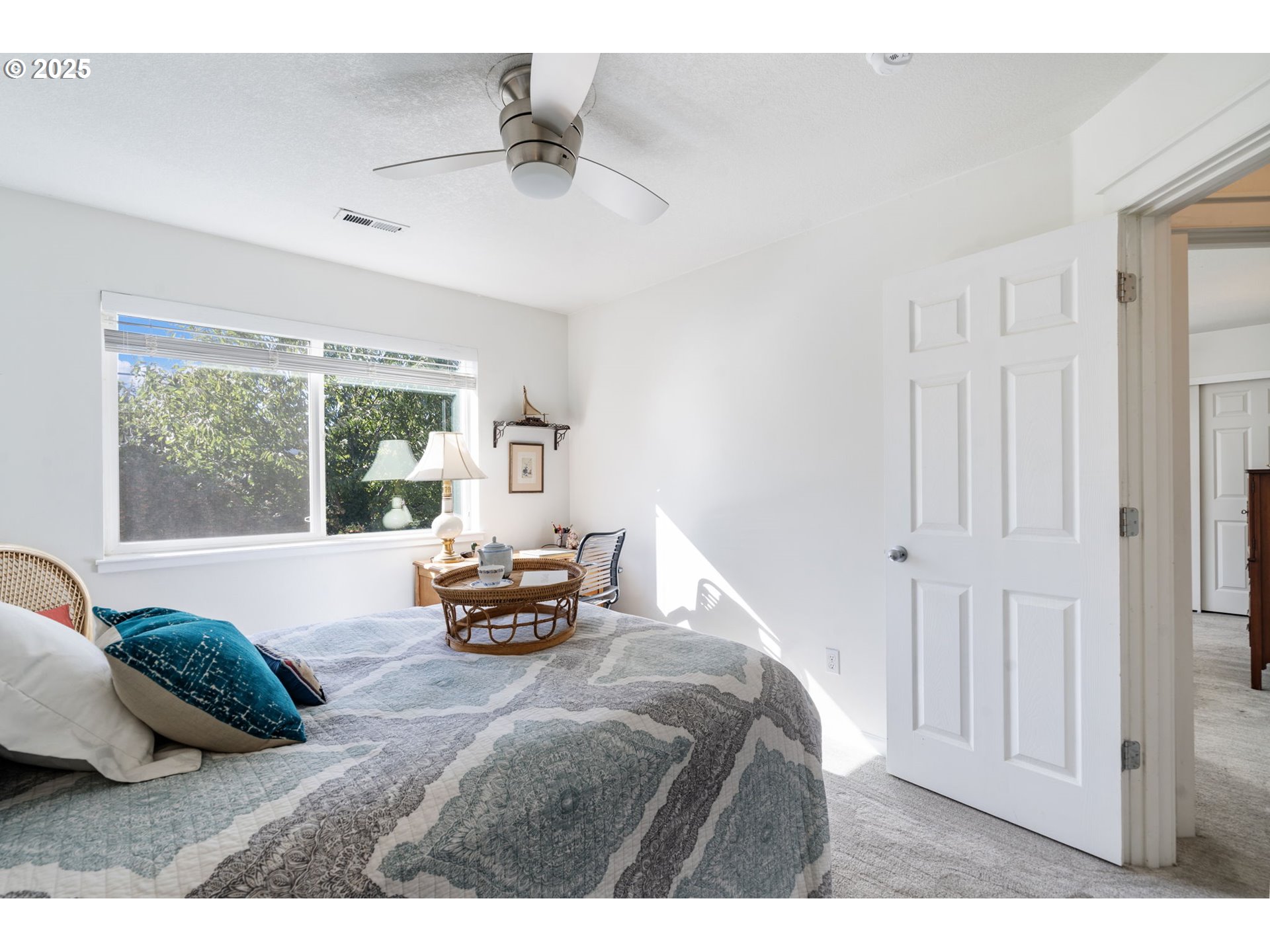21780 Northeast Larkspur Lane Fairview, OR 97024 - Photo 26 of 31 a bedroom with a bed and a large window