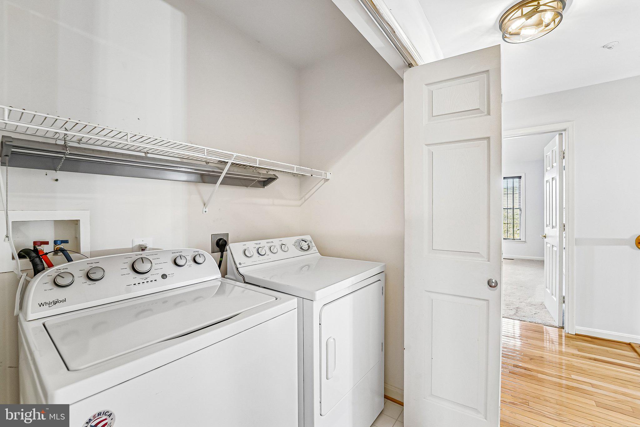 2422 Rippling Brook Road Frederick, MD 21701 - Photo 24 of 35 a utility room with dryer and washer