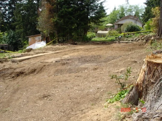 a backyard of a house with a yard and garage