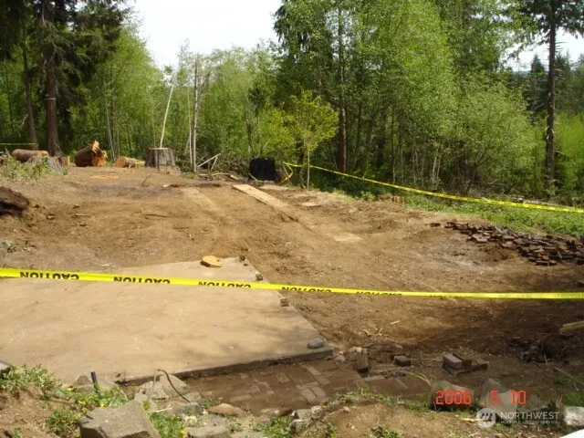 a view of a swimming pool with a yard