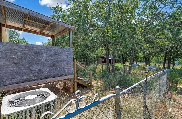 a view of swimming pool with a patio