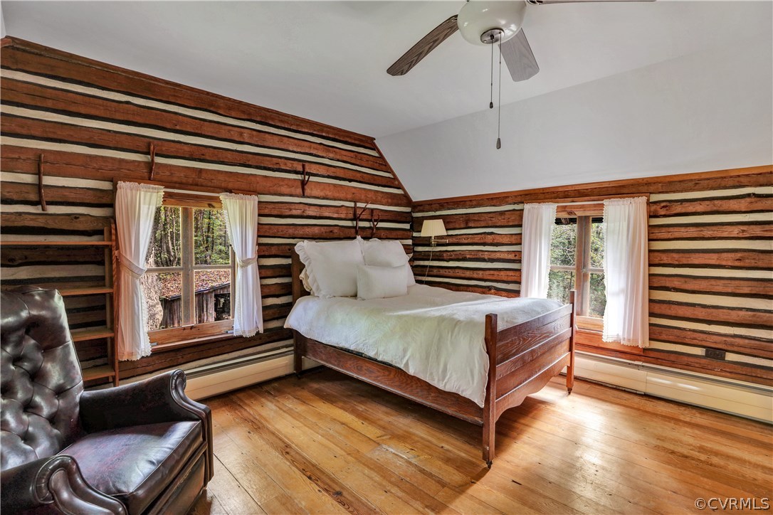 1444 Genito Road Manakin-Sabot, VA 23103 - Photo 14 of 47 a bedroom with a bed and wooden floor
