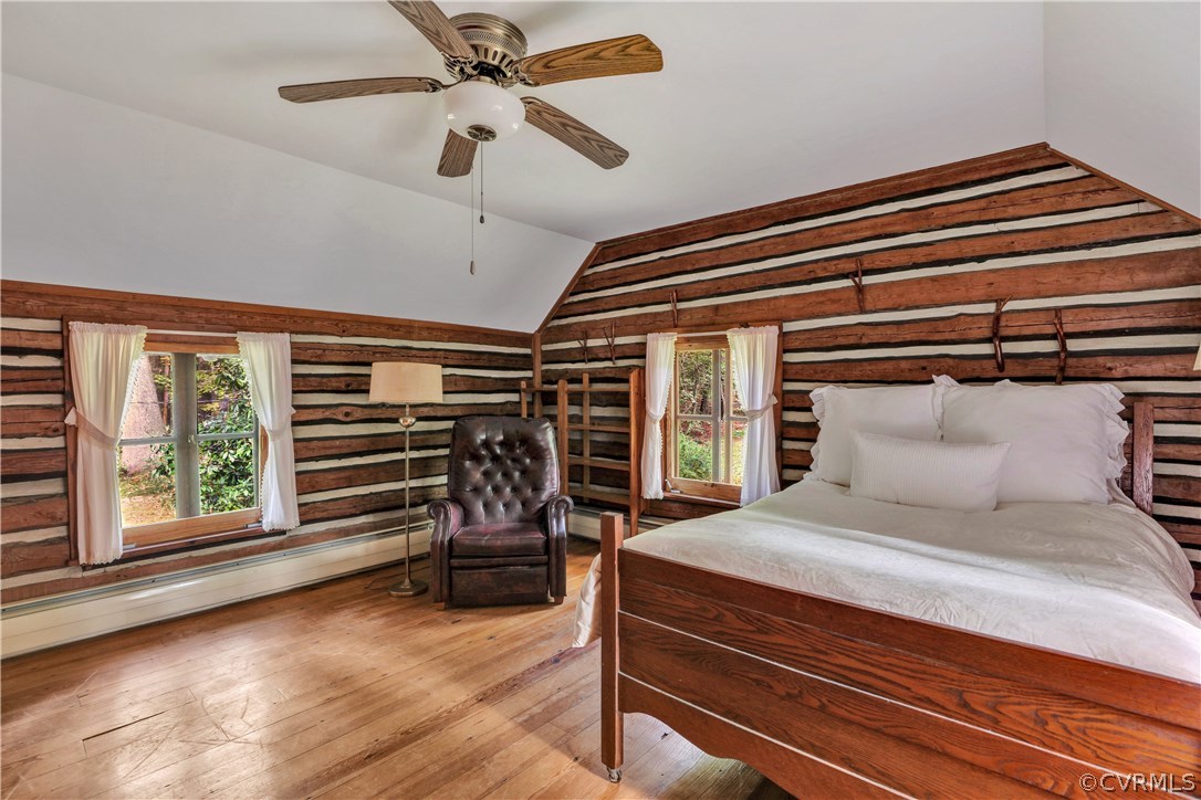 1444 Genito Road Manakin-Sabot, VA 23103 - Photo 15 of 47 a bedroom with a bed and a chandelier