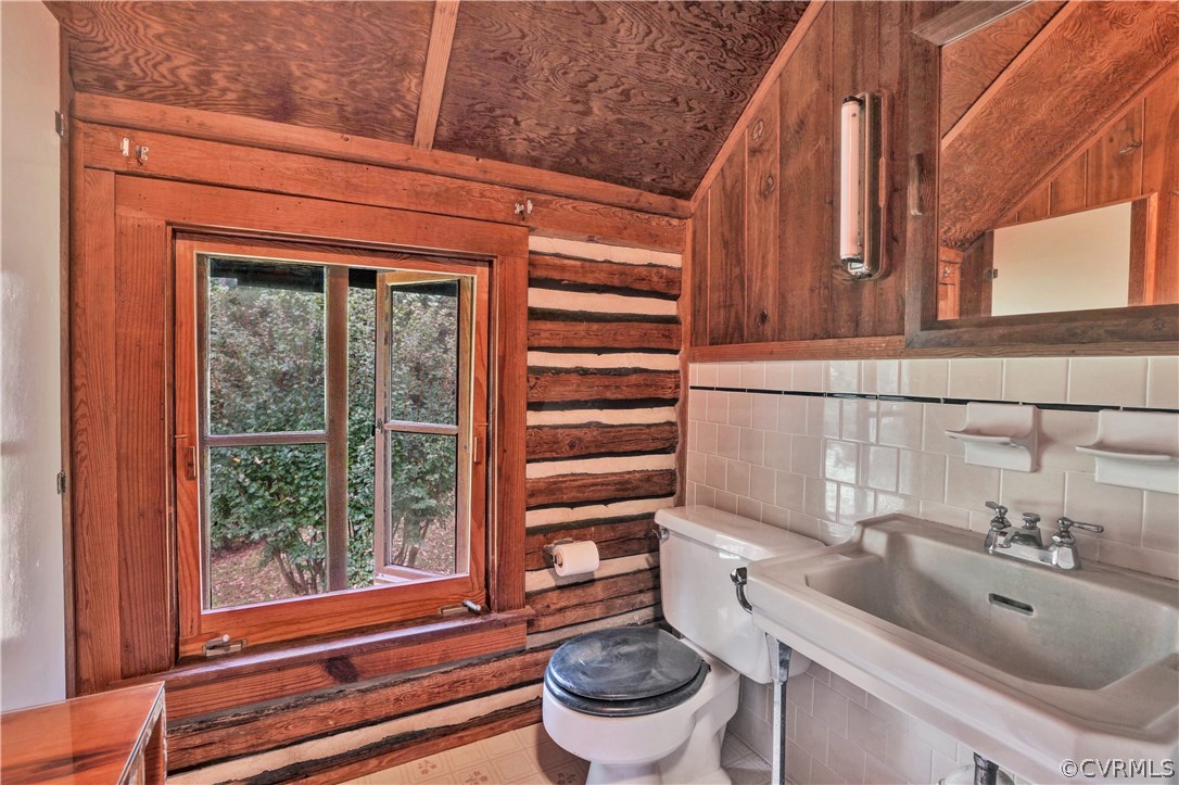1444 Genito Road Manakin-Sabot, VA 23103 - Photo 21 of 47 a bathroom with a sink a toilet and a mirror