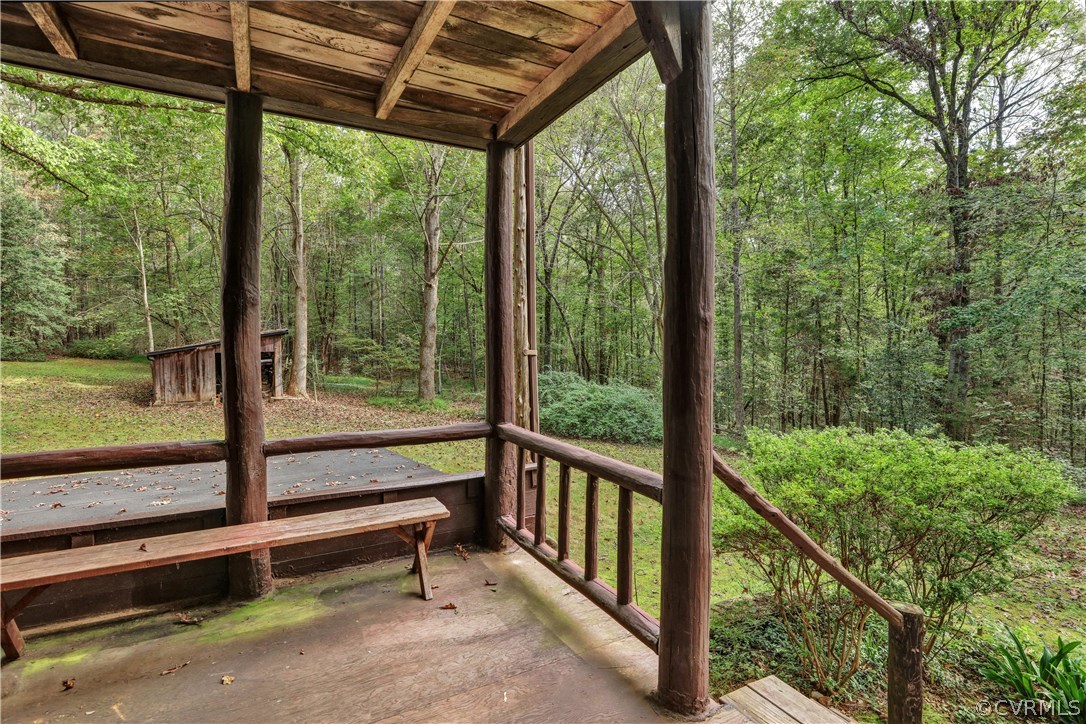 1444 Genito Road Manakin-Sabot, VA 23103 - Photo 30 of 47 a view of a porch with a wooden door and deck