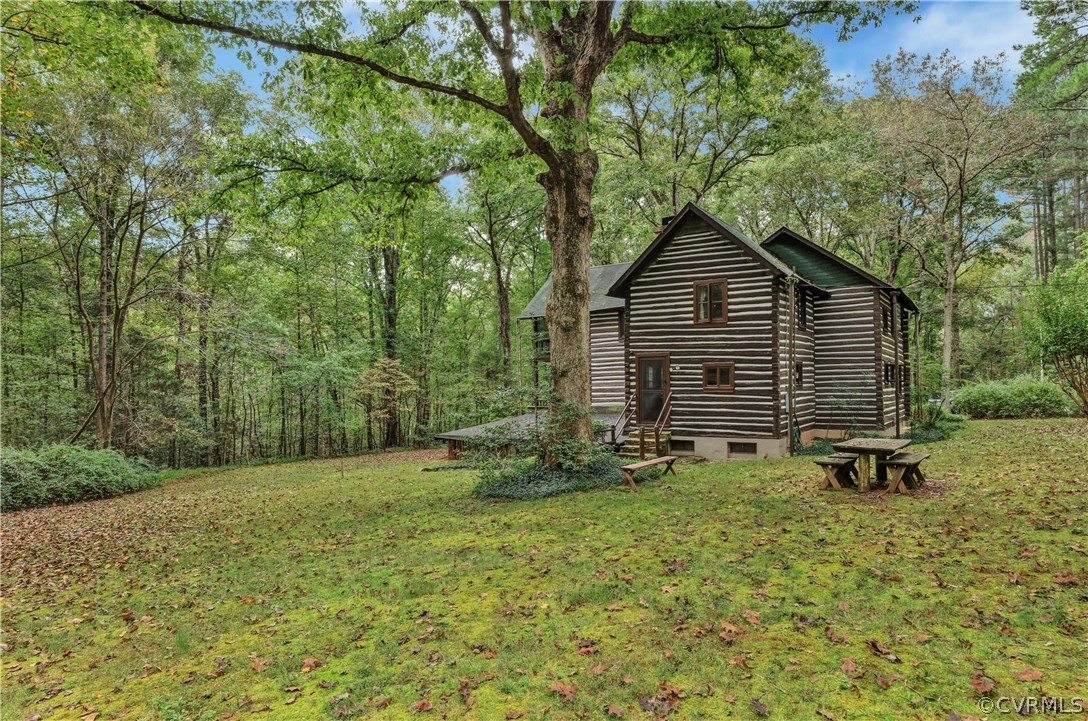 1444 Genito Road Manakin-Sabot, VA 23103 - Photo 34 of 47 a view of backyard with a barn and large trees