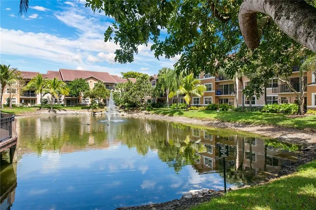 a view of a lake with a building in front of it