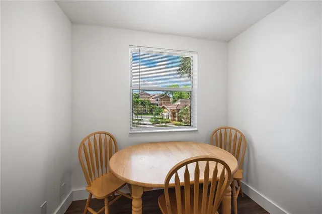 a view of a bedroom with furniture and windows